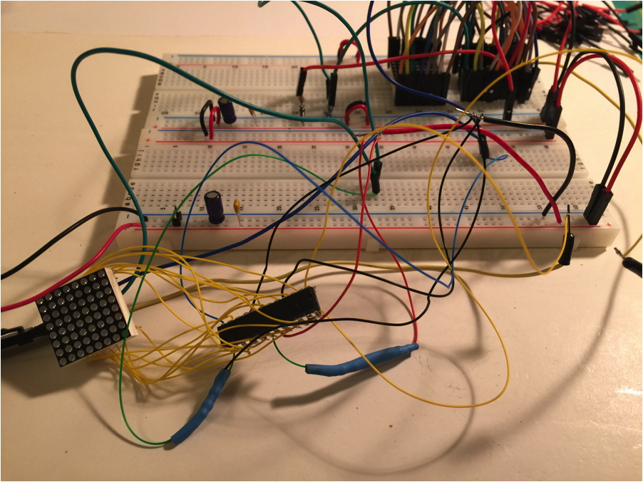 1 wire-wrapped LED Matrix and controller chip connected back to the breadboard for testing